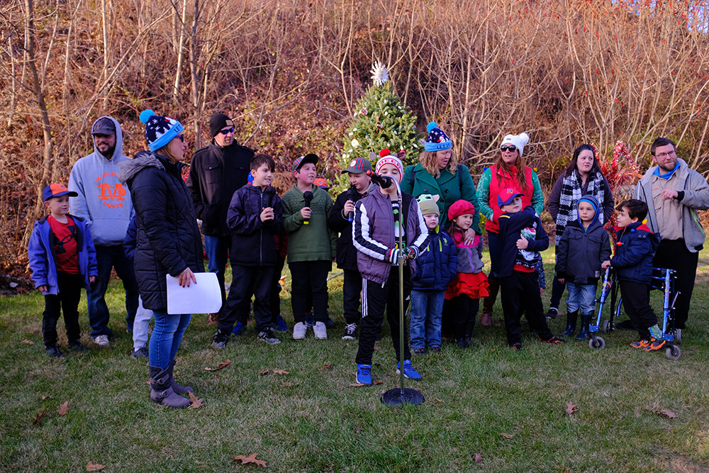 The Cub Scouts led in the singing of Christmas and Holiday favorites.